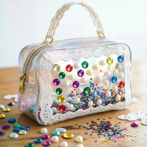 Aurora lace and gem shaker vanity case, a decorative wholesale makeup organizer with lace trim, gem accents, and playful shaker detail